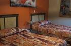 Chambre avec deux lits doubles&nbsp;&nbsp;&nbsp;&copy; Motel Au Soleil Couchant