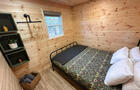 Lit queen avec lit simple gigogne sous celui-ci&nbsp;&nbsp;&nbsp;&copy; Chalet Sea Brise