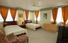 Chambre supérieure avec 2 lits doubles